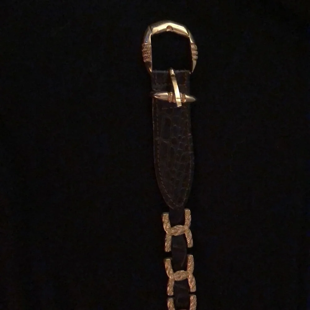 Gold and brown belt 35 inches to first hole. Size M